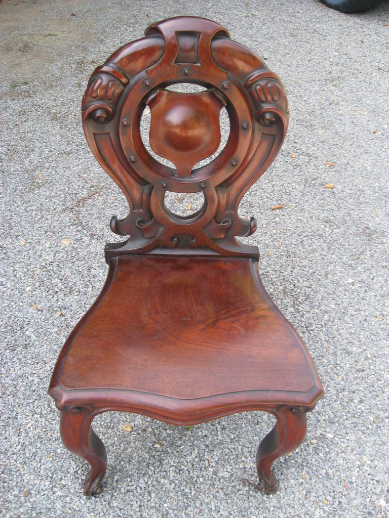 Pair of 19th century English mahogany hall chairs.