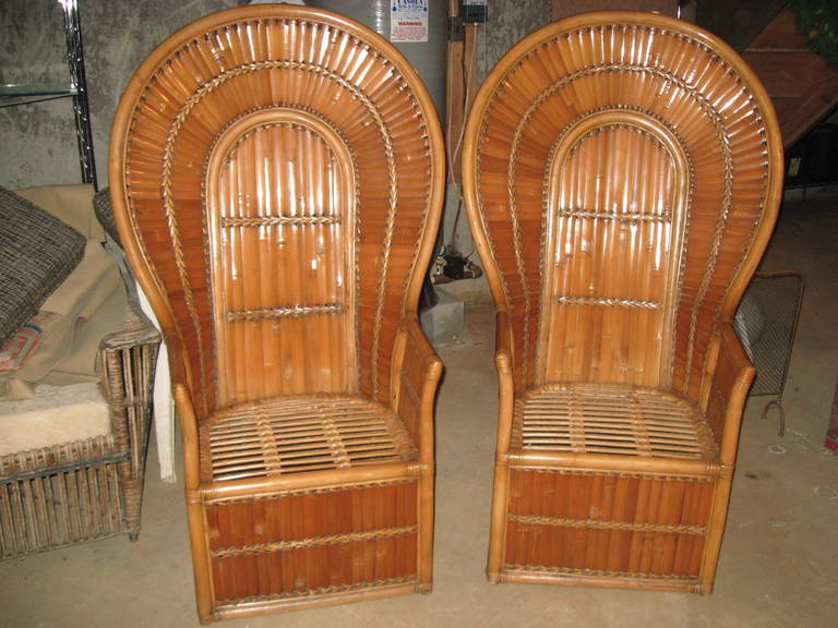 Pair of vintage bamboo and wicker peacock lounge chairs with cushions
arm to arm 24