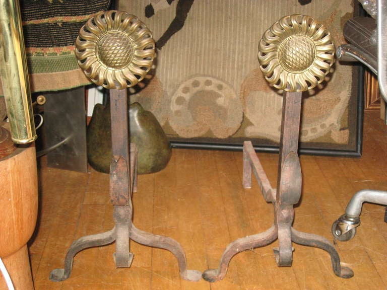 Pair of brass and hand-forged iron sunflower andirons.