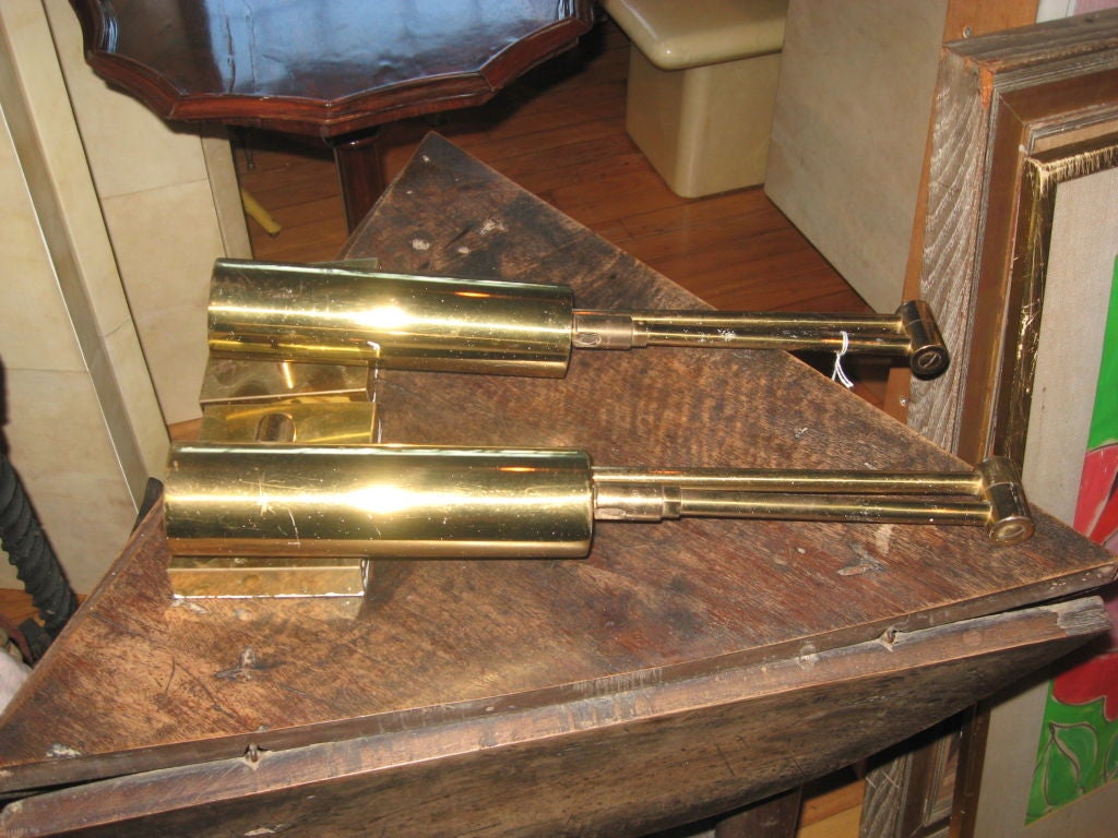 Two pair of Koch & Lowy brass wall sconces with swinging arm and piviting shade. Arm extends 32", closed 17 1/2". Wall plate 4 X 5".
Price per pair.