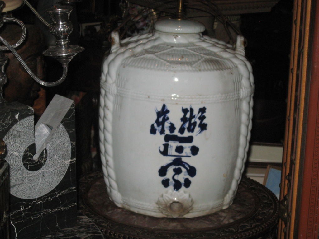 Antique large sake blue and white jar made into lamp.