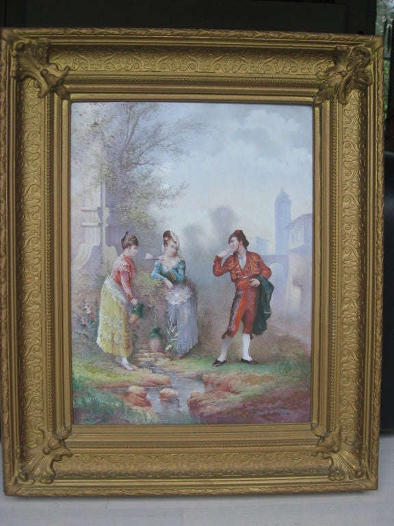 Hand-painted porcelain plaque in giltwood frame, signed and size includes frame.