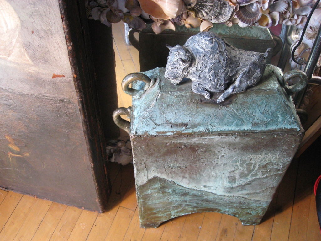 Bronze box with buffalo on top of cover signed by artist with great patina. (very heavy)
can be used by a fireplace to store wood