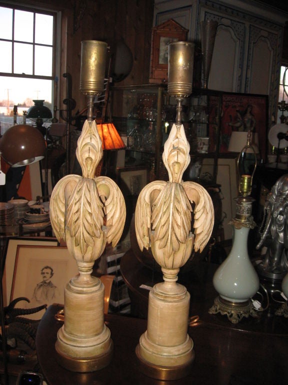 Pair of carved wood and gilt polychromed art modern table lamps with porcelain reflectors to hold shades three way switch.