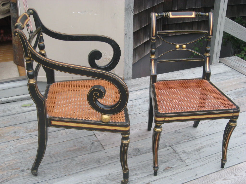 Set of Ten Regency Period Ebonized and Parcel Gilt Cane Dining Chairs in the Manner of John Gee-Two Arm and Eight Side Chairs-Arm Chairs with Brass Casters-All with Hand Made Cushions