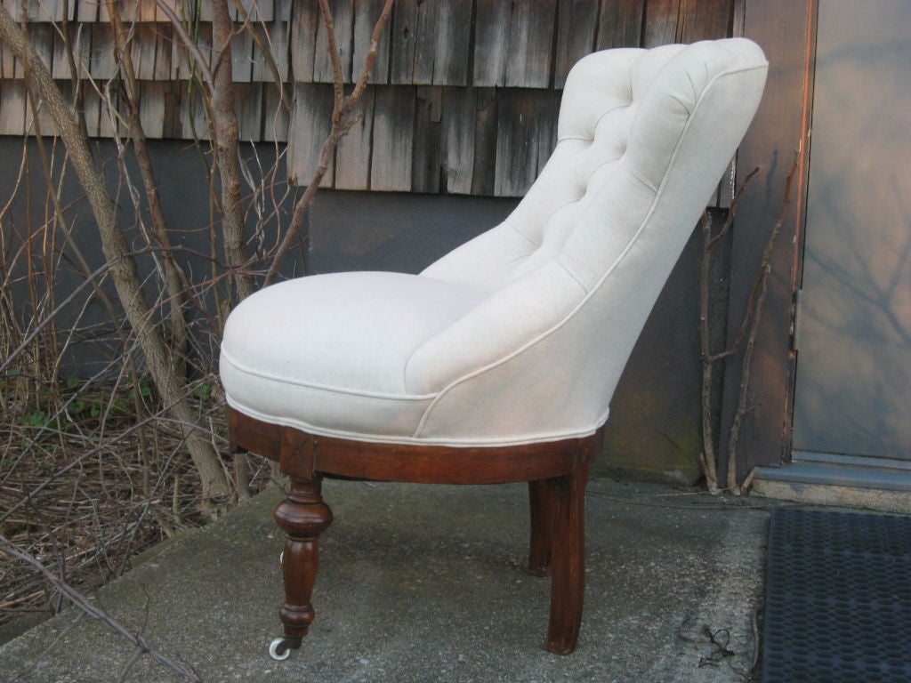 Tufted Napoleon III bergere chair. Carved walnut legs and porcelain wheels.
H 30" W 30" D 30"
Seat H 17" Seat D 17".