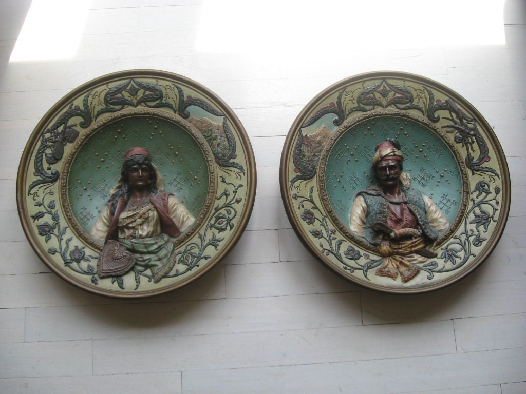 Pair of terracotta hand-painted plates.