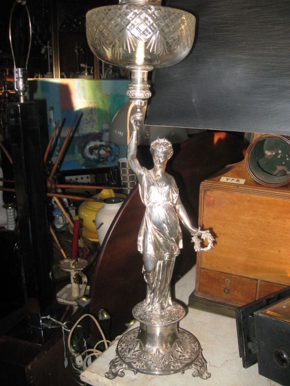 Silver plated figural oil lamp electrified-figure with oil crystal is 25