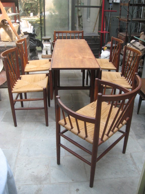  Mid Century Danish Modern Six Teak Dining Chairs ...Four Side and Two Arm by  Jorgen Baekmark....Also Available a 1950s Danish modern teak drop-leaf table  designed by Jorgen Baekmark and built by Moller Mobler Danish teak fabric....Each side panel