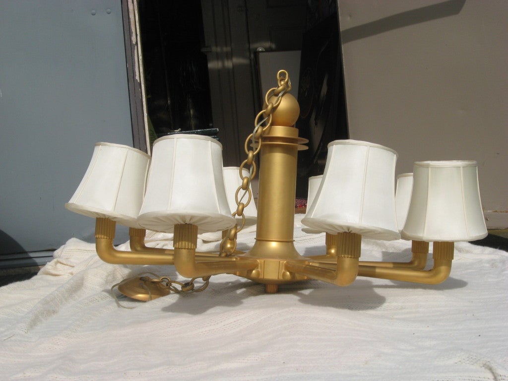 Fabulous handcrafted gilded bronze eight-light chandelier in the Art Deco style in the style of Ruhlmann by Augstell, with six custom silk shades.
