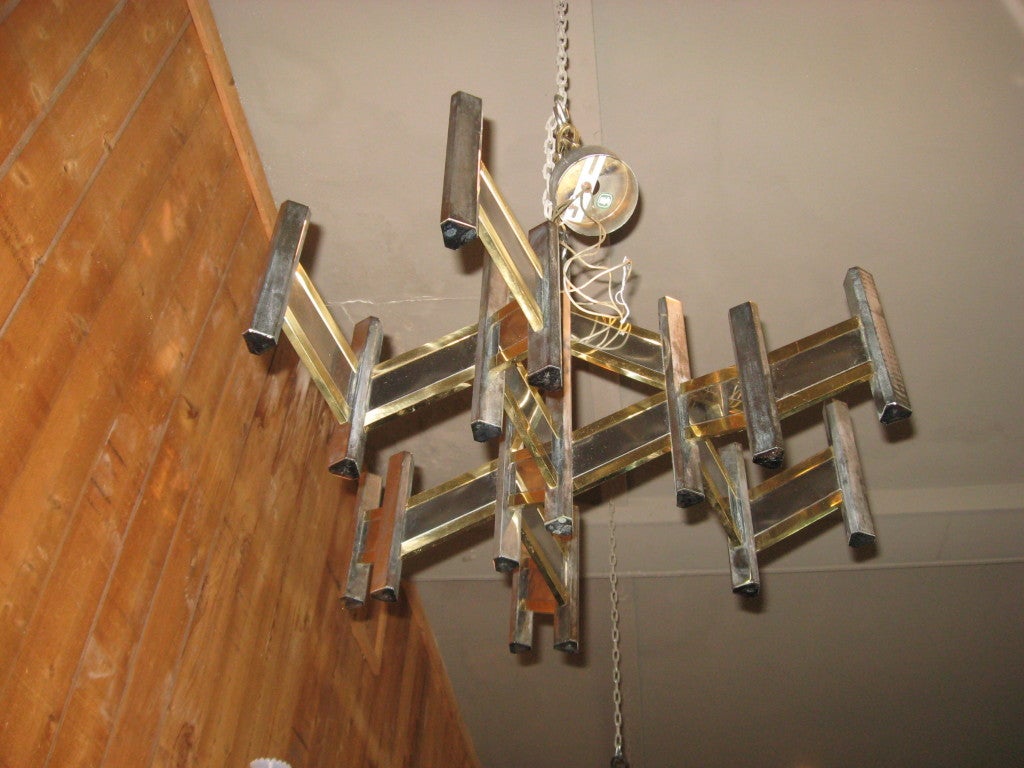Fourteen-light Mid-Century chrome and brass signed chandelier by Sciolari with original ceiling cap.