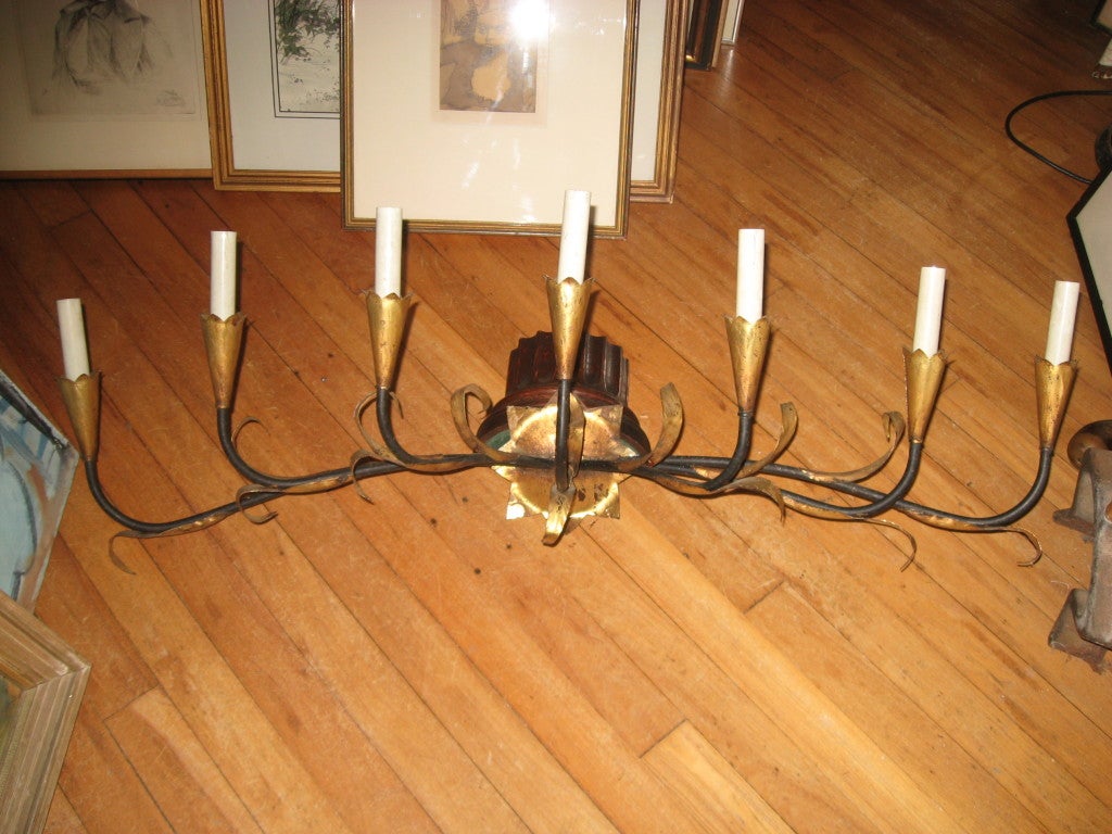 Midcentury pair of seven-light gilded tin and iron sconces-wired.