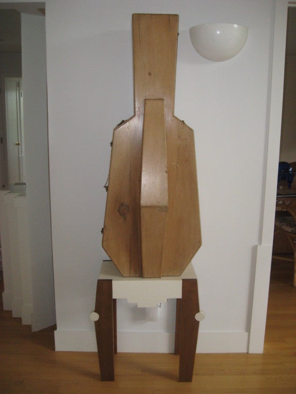 Similar pair of antique wood cello cases on custom-made modern stands, placed as sculptures.