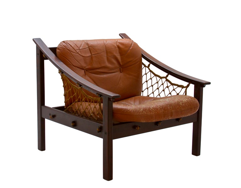 Gillon’s Amazonas armchair riffs on materials and techniques of Brazilian fishermen, seen in the piece’s netted structure and comfort.  Romanian born Jean Gillon (1919 – 2007) immigrated to Brazil in 1956 where he identified local materials and