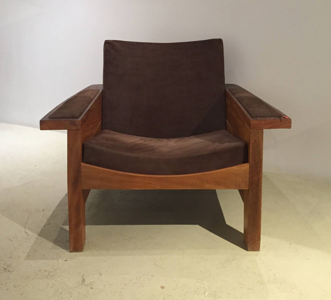'Braz' armchair by Carlos Motta.
Made of reclaimed Peroba rosa with a wax finish. Rustic brown leather.