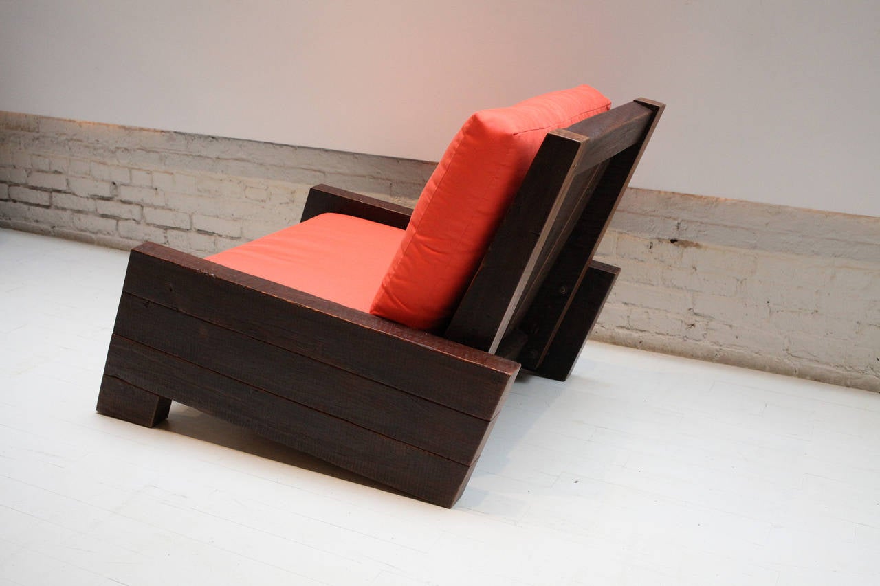 Asturias armchair by Carlos Motta.
Made of reclaimed Peroba rosa with a wax finish. Slipcovers in orange fabric.