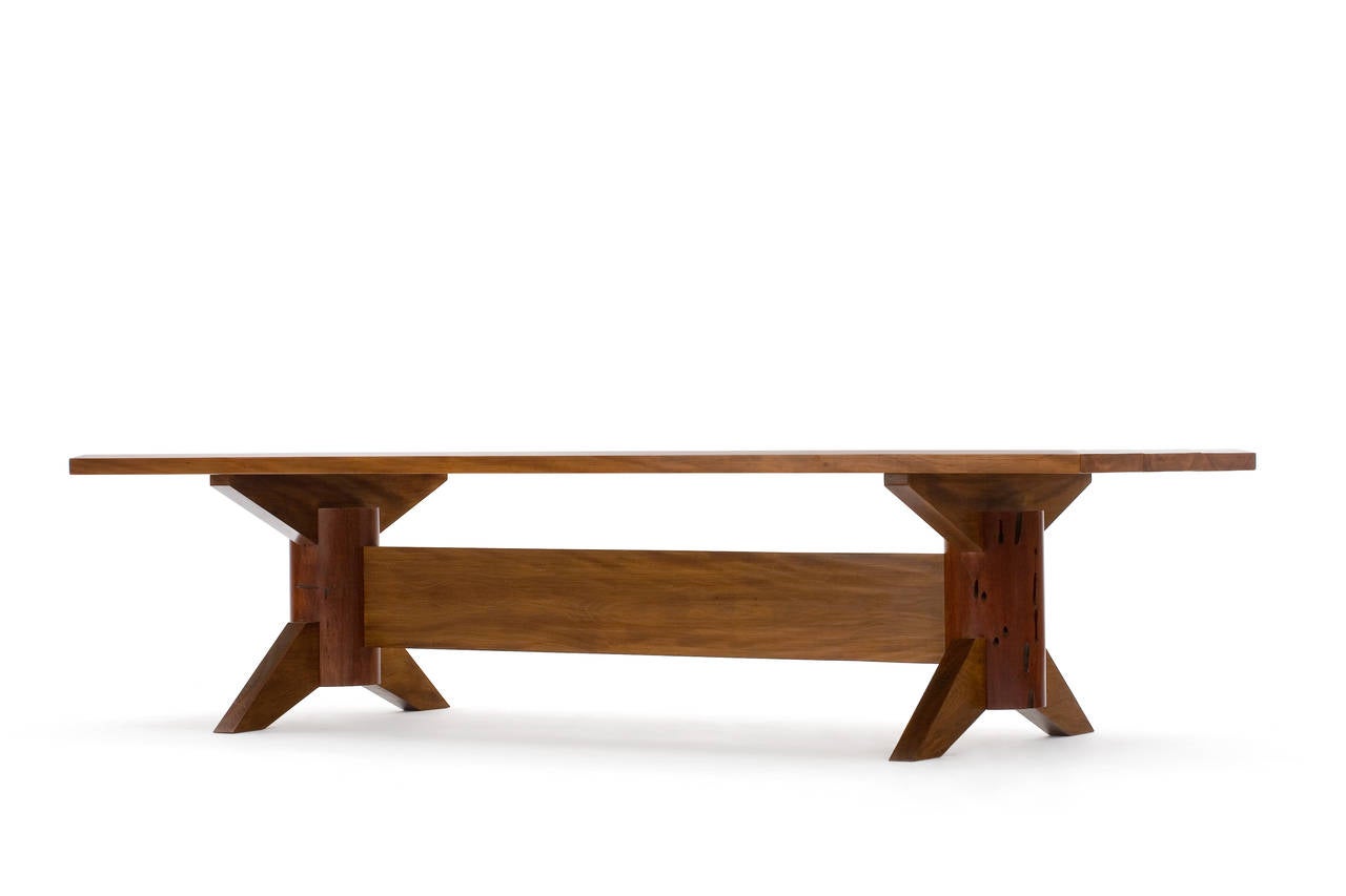 Edition of 1
This one-of-a-kind dining table is the perfect representation of Carlos Motta's work, combining the rustic and eco-friendly aspects of reclaimed wood, with the bold and clean lines of his designs. 
Handcrafted in a mix of solid