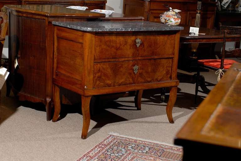 A walnut commode with grey marble top, 2 drawers and splayed feet.

William Word Fine Antique: Atlanta's source for antique interiors since 1956.