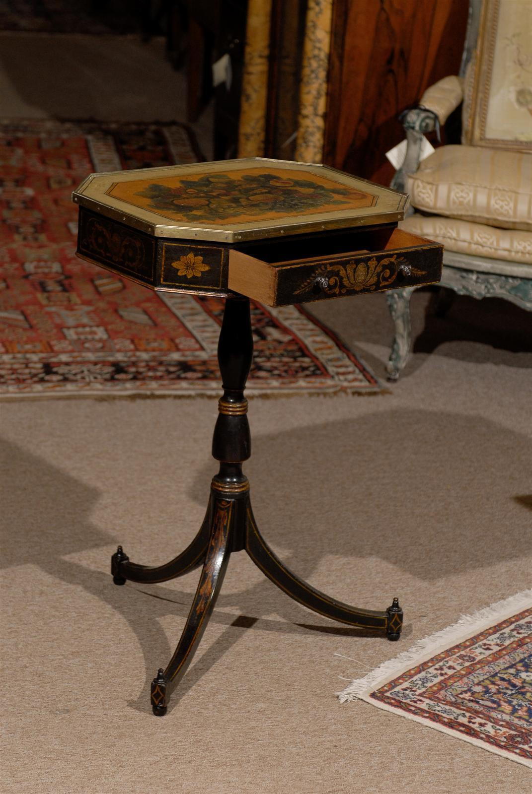 A Regency style side table with decoupage floral decorated top, drawer and tripod base. 

William Word Fine Antiques: Atlanta's source for antique interiors since 1956.