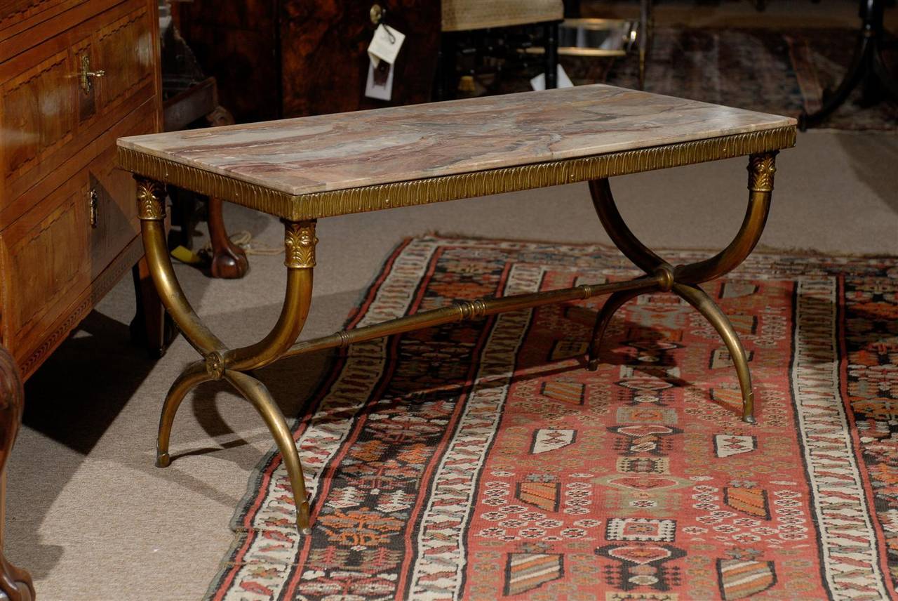 Neoclassical style X leg coffee table with marble top, 20th century Continental.

To view our full inventory, please visit our online gallery.