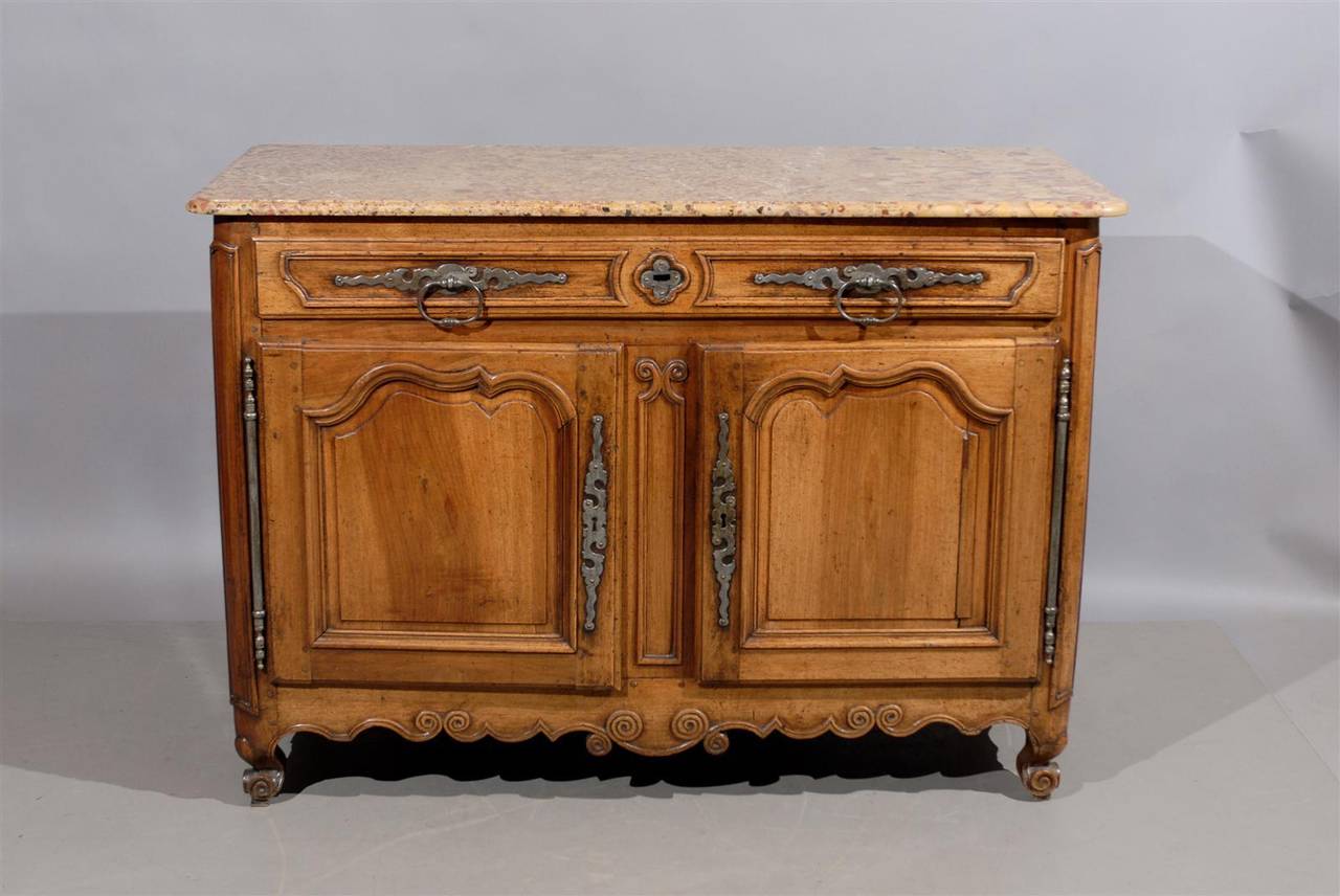 A Louis XV Walnut Buffet with Breche d'alep marble-top, paneled doors and ends and heavy steel hardware. This piece dates from the 18th century and is French in origin.

To view our entire inventory, please visit our website.

William word fine
