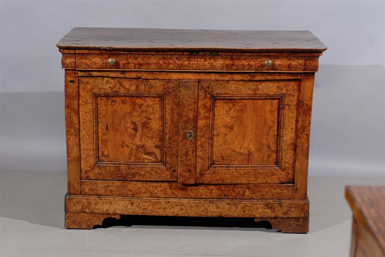 A French burled walnut buffet with drawer and two cabinet doors below.

William Word fine Antiques: Atlanta's source for antique interiors since 1956.
