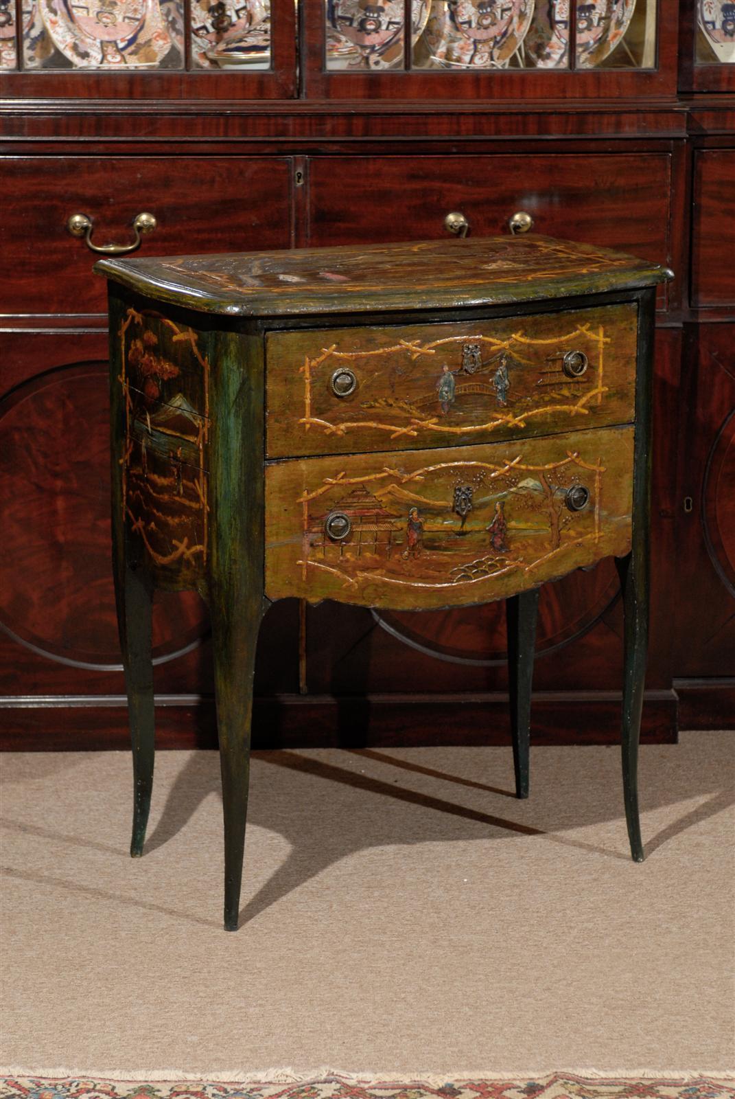 A petite chinoiserie style painted commode with two drawers and splayed feet. 

William Word Fine Antiques: Atlanta's source for antique interiors since 1956.