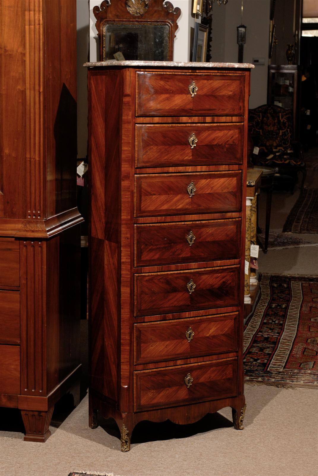 18th Century French Louis XV tulipwood semanier with marble top, 7 drawers and bronze dore mounts. 

William Word Fine Antiques: Atlanta's source for antique interiors since 1956.