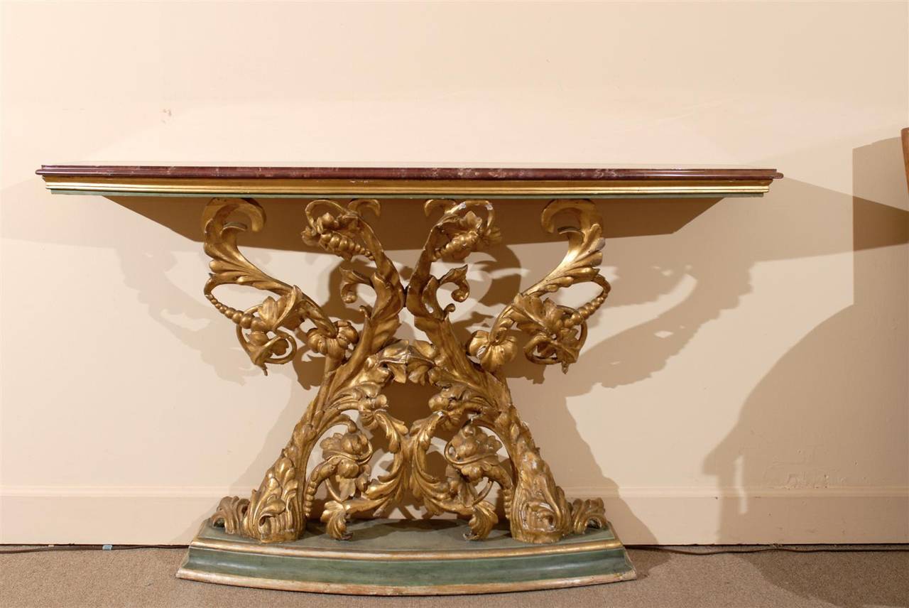 A narrow console table with marble top and gilt-carved base. 

William Word Fine Antiques: Atlanta's source for antique interiors since 1956.