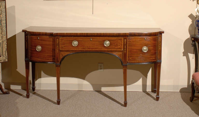 Early 19th Century English Mahogany Breakfront Sideboard with Boxwood String Inlaid Designs, Satinwood Cross-banding and Square Tapering Legs Terminating in Spade Feet.

TO SEE ALL OF OUR INVENTORY PLEASE VISIT OUR WEBSITE.

William Word Fine