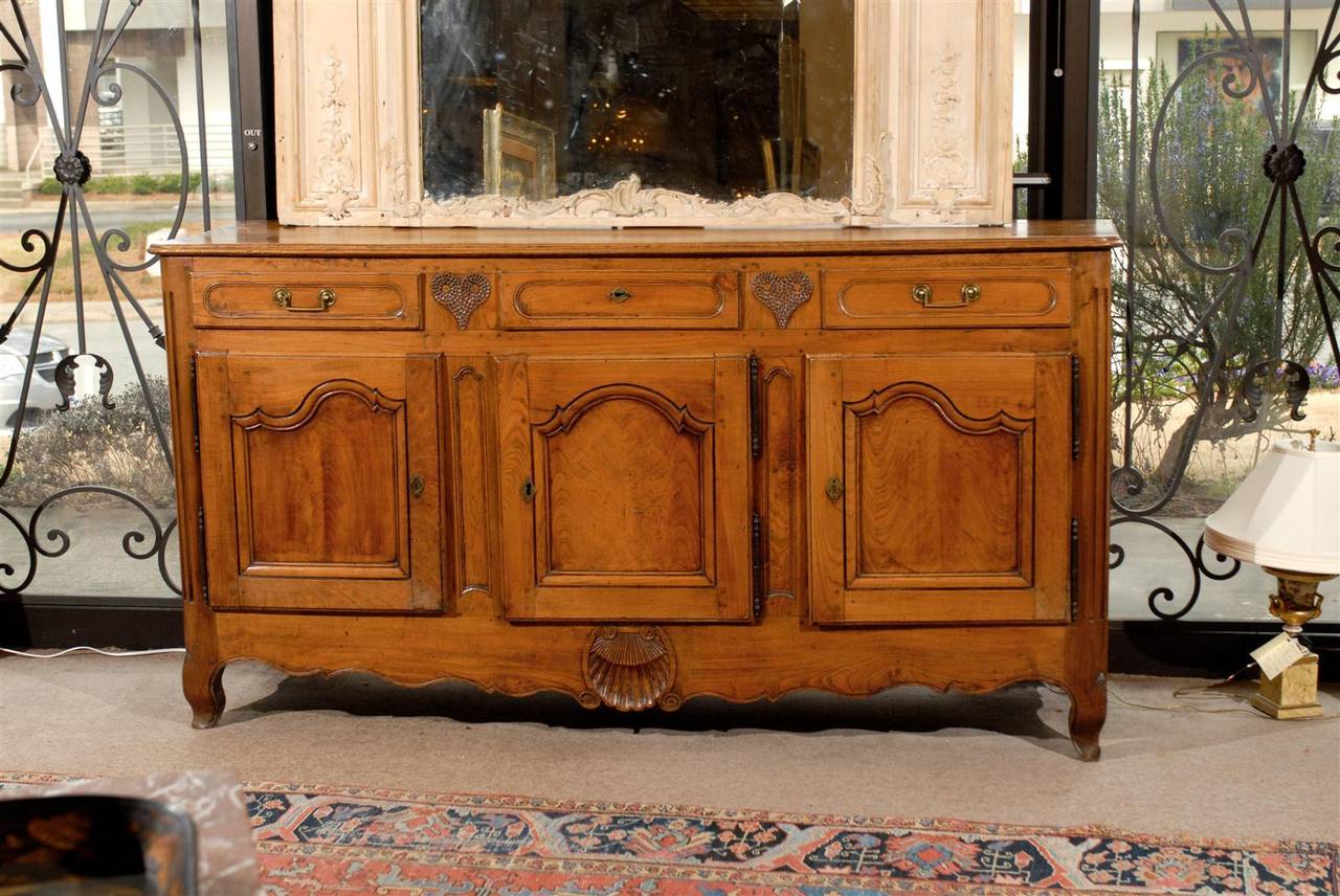 Large 18th century French Louis XV Fruitwood and elm enfilade with heart and shell carvings.