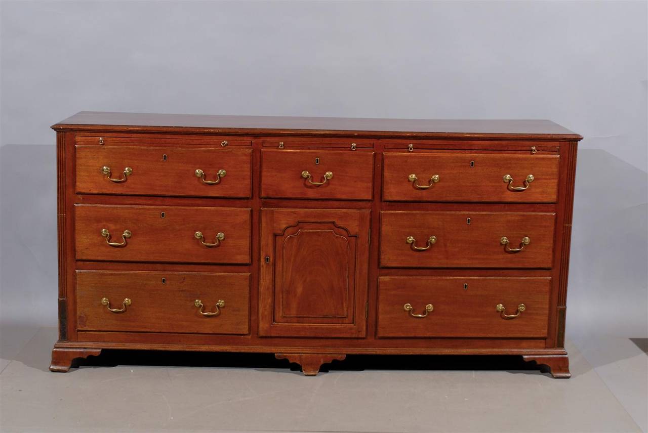 19th century English oak dresser base with six drawers, one door, three slides and ogee feet.

William Word Fine Antiques: Atlanta's source for antique interiors since 1956.