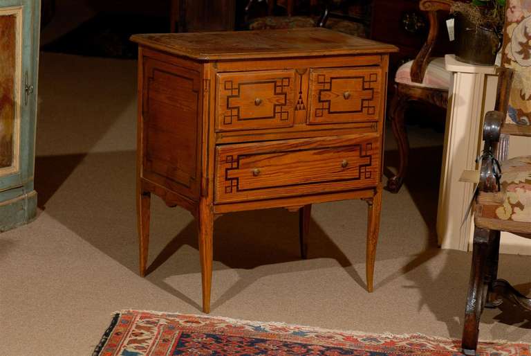 Rustic French Petite Commode in Pine with Parquetry inlay, 3 drawers and tapered legs. 

William Word Fine Antiques: Atlanta's source for antique interiors since 1956.