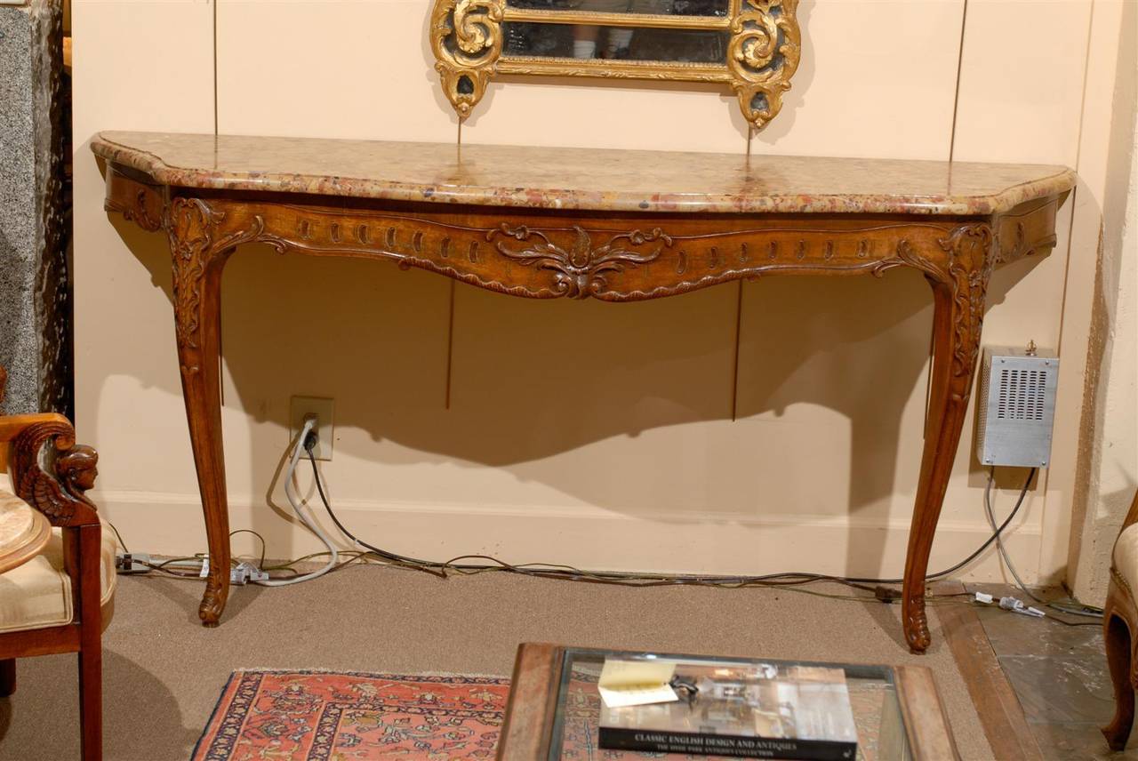 Large 19th century French Regence style wall-mounted oak console with shaped marble top.