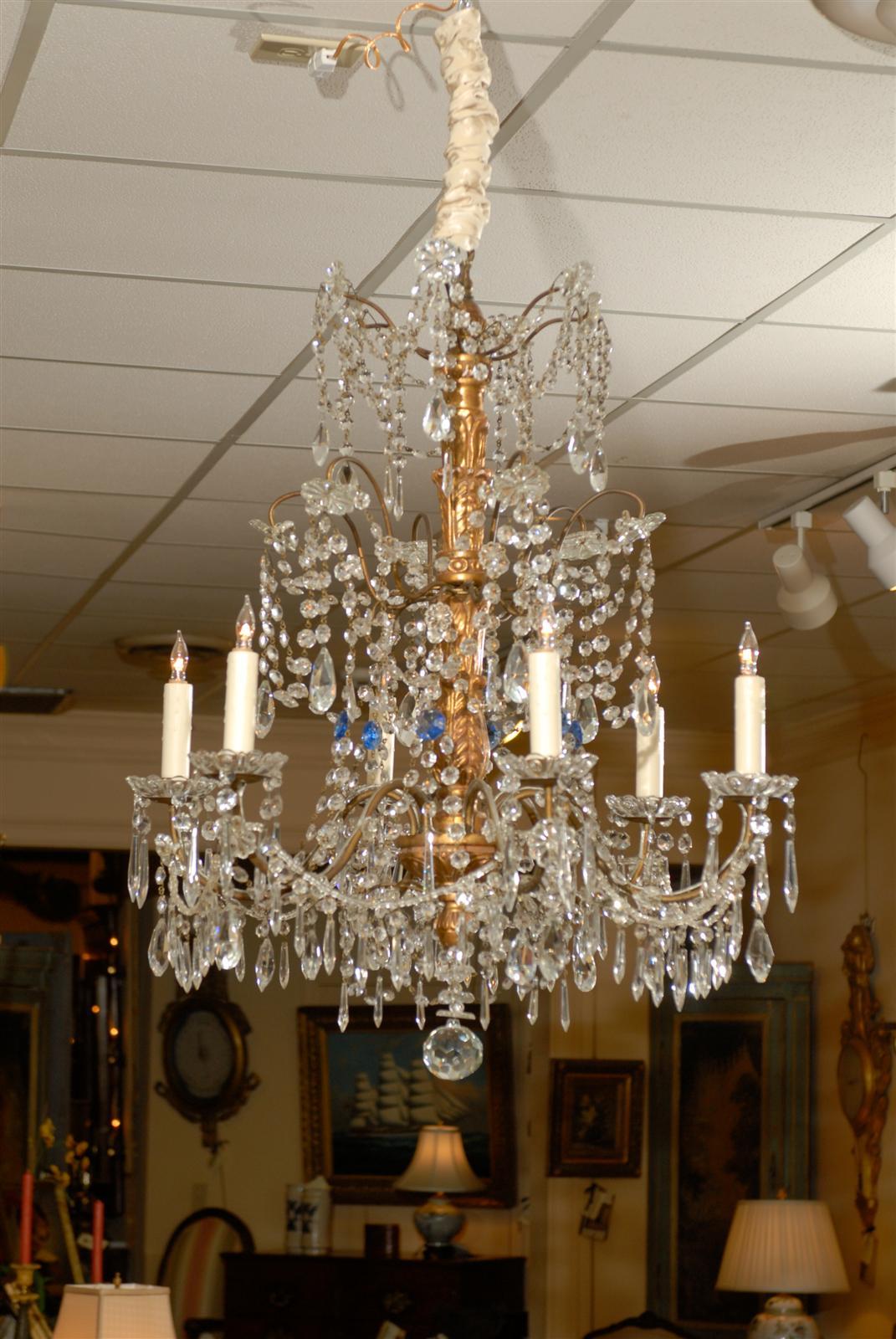 Italian neoclassical style crystal and giltwood chandelier with six-lights and blue crystal accents.

William Word fine antiques: Atlanta's source for antique interiors since 1956.