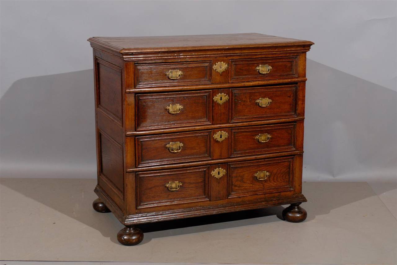18th century English Jacobean style oak chest with bun feet and five drawers.

William Word Fine Antiques: Atlanta's source for antique interiors since 1956.