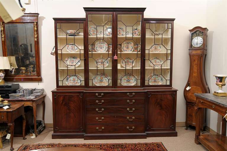 A Large English George III 19th Century Mahogany Breakfront Bookcase with Secretary Drawer.