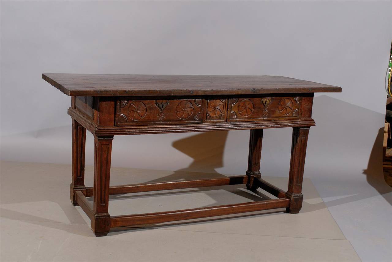 An Oak and Walnut Console Table with Carved Frieze with 2 Drawers and Stretchers, dating from the early 19th Century and Italian in origin.