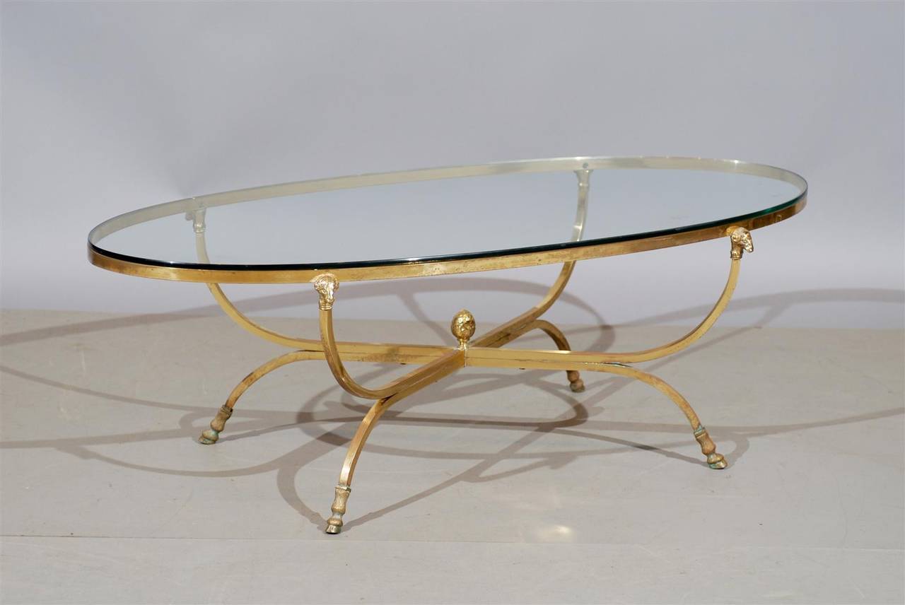 An Oval Jansen Style Brass and Glass Coffee Table with Ram's Head Detail and Hoof Feet, 20th Century France

To view our entire inventory, please visit our personal website.

William Word Fine Antiques: Atlanta's source for antique interiors