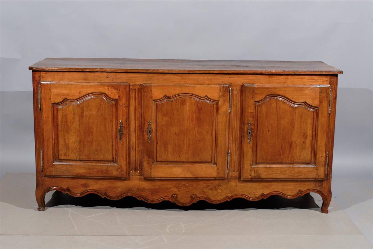 Transitional Louis XV/XVI French fruitwood enfilade with three doors, circa 1800.