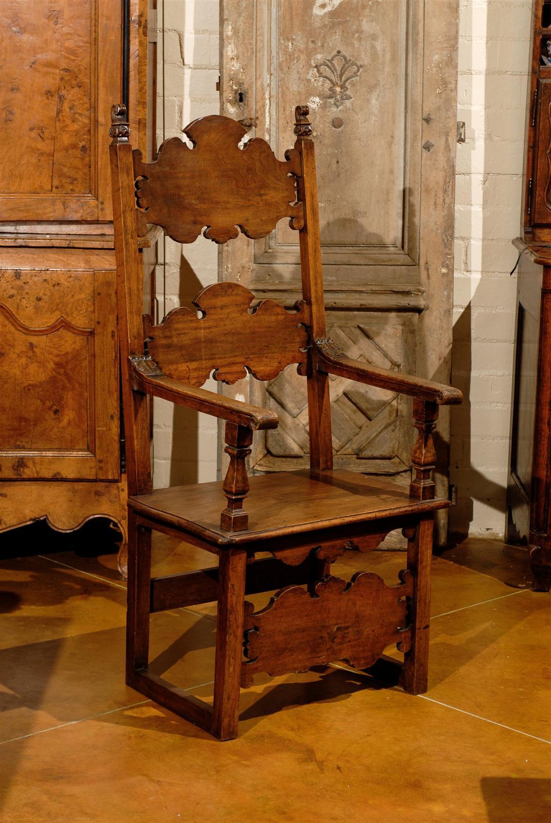 A large 18th century Italian walnut armchair with high back.