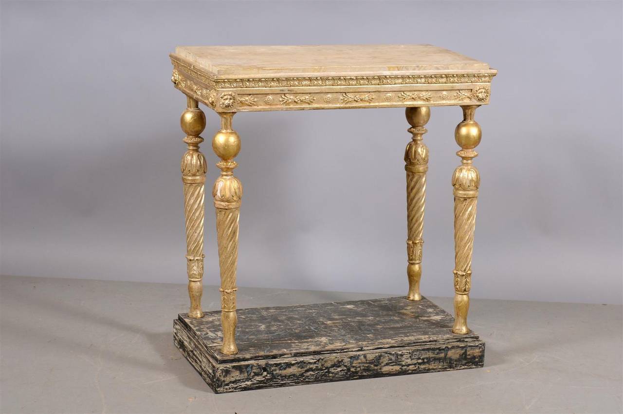 Late 18th century Swedish neoclassical giltwood console with painted wood top and base. 
 
William Word Fine Antiques: Atlanta's source for antique interiors since 1956.