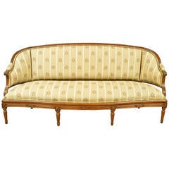 Antique Louis XVI Walnut Settee with Cane Back and Fluted Legs, France, circa 1790
