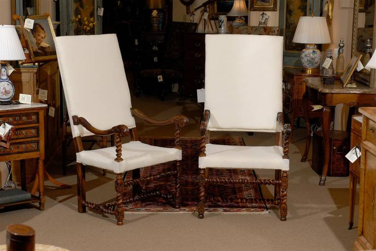 Pair of 19th century French Louis XIII style walnut fauteuils ( Armchairs) with barley twist stretchers. 

William Word Fine Antiques: Atlanta's source for antique interiors since 1956.