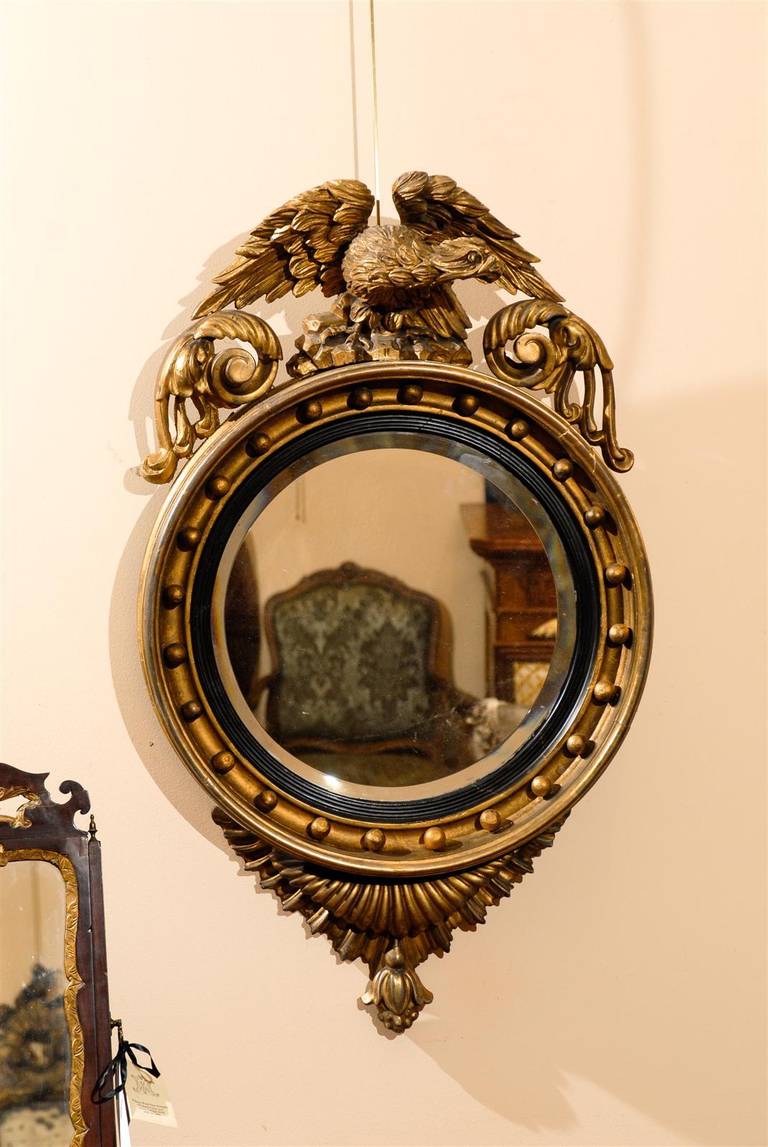 19th Century English Gilt-Wood Bull's Eye Mirror with Eagle Crest
