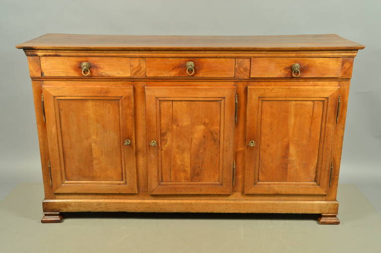 A Louis Philippe French Enfilade in fruitwood with 3 drawers, doors and lion head pulls. 

William Word Fine Antiques: Atlanta's source for antique interiors since 1956.