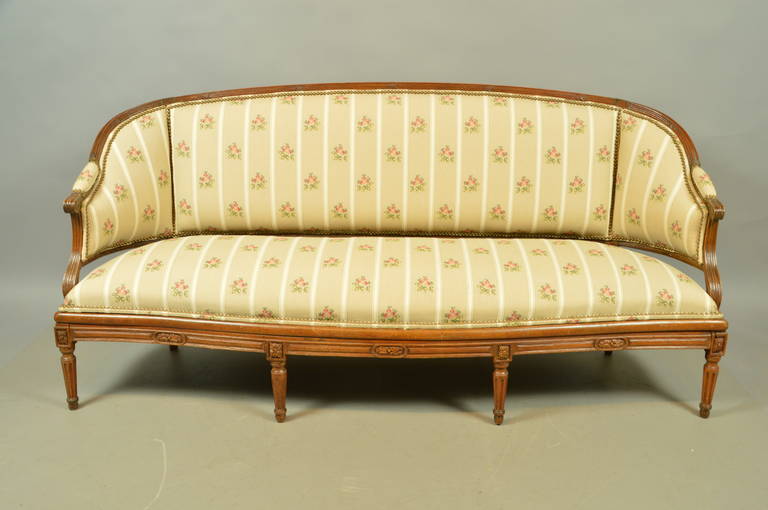 French Louis XVI Walnut Settee with Cane Back and Fluted Legs, France, circa 1790