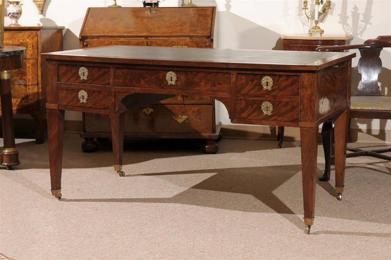 19th century French Directoire style mahogany bureau plat with leather top, 5 drawers with fitted interior and castors. 

To view our entire inventory, please visit our personal website. 

William Word Fine Antiques: Atlanta's source for antique