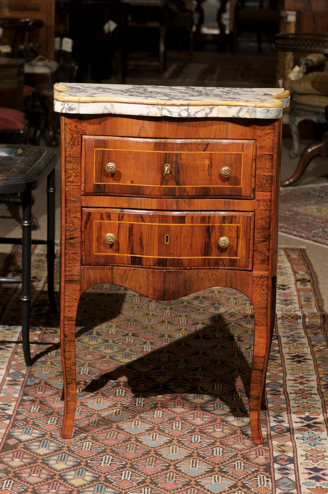 Petite Italian serpentine commode in rosewood veneer with string boxwood inlay , inlaid marble top, 2 drawers. shaped apron and splayed feet. 

William Word Fine Antiques: Atlanta's source for antique interiors since 1956.