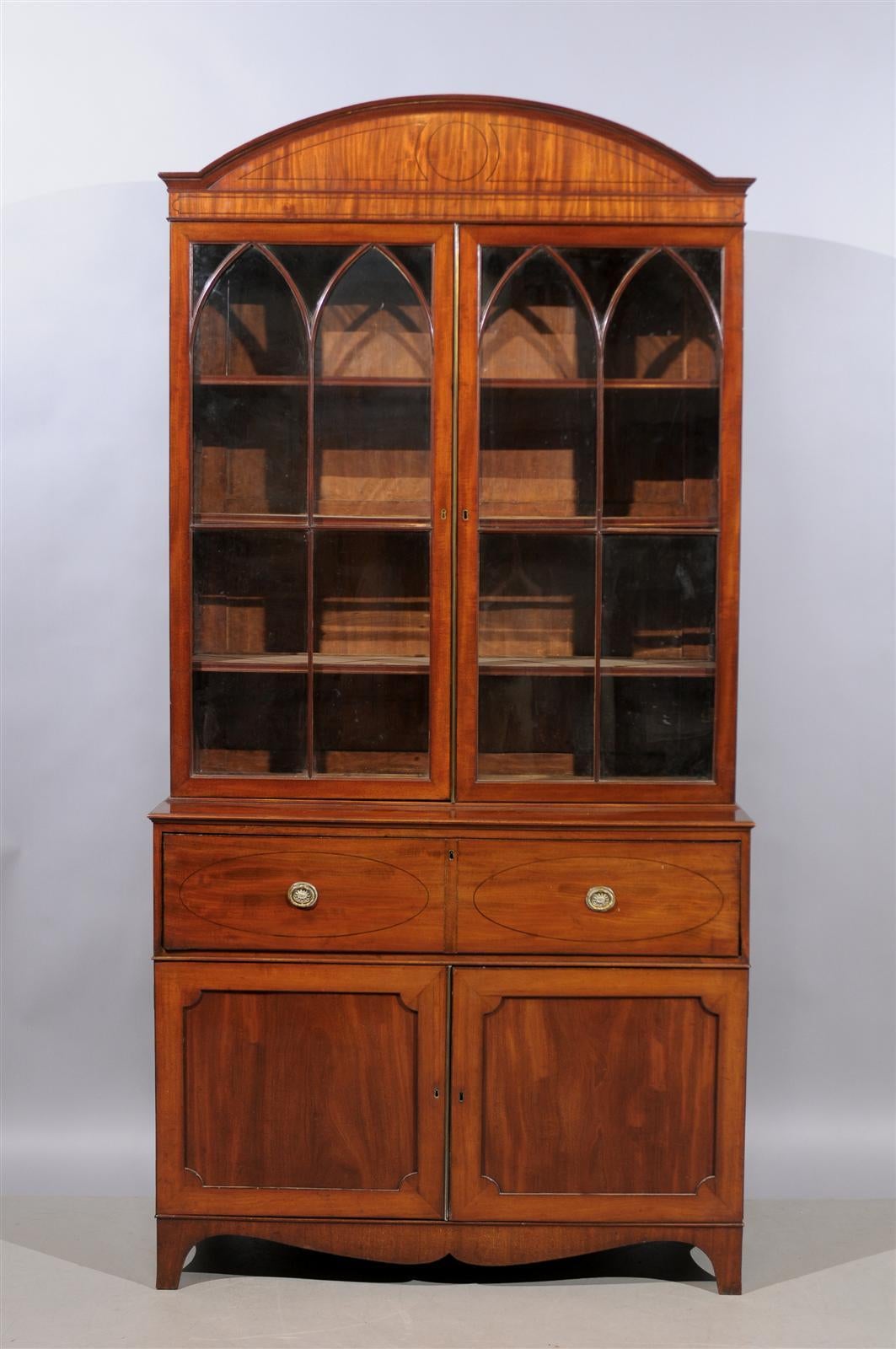 A 19th Century English George III Mahogany Secretary Bookcase with Dome Top, secretary drawer satinwood fitted interior, leather writing surface and cabinet below. 